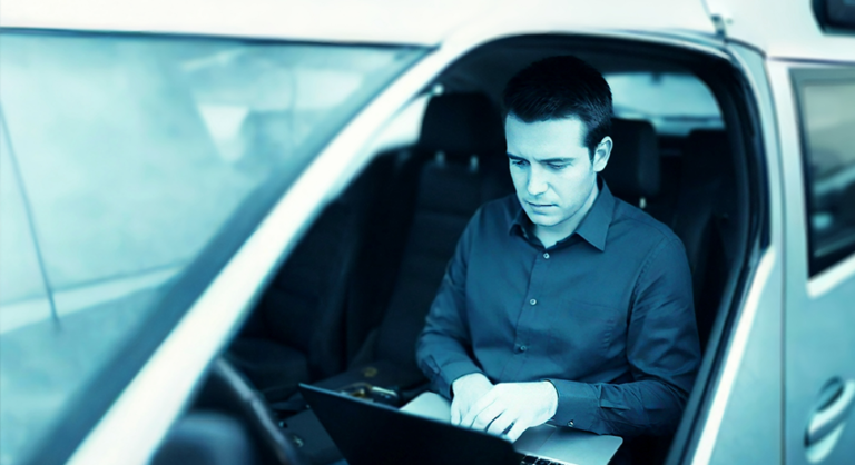 a man sitting in a van hacking a local business in Georgia